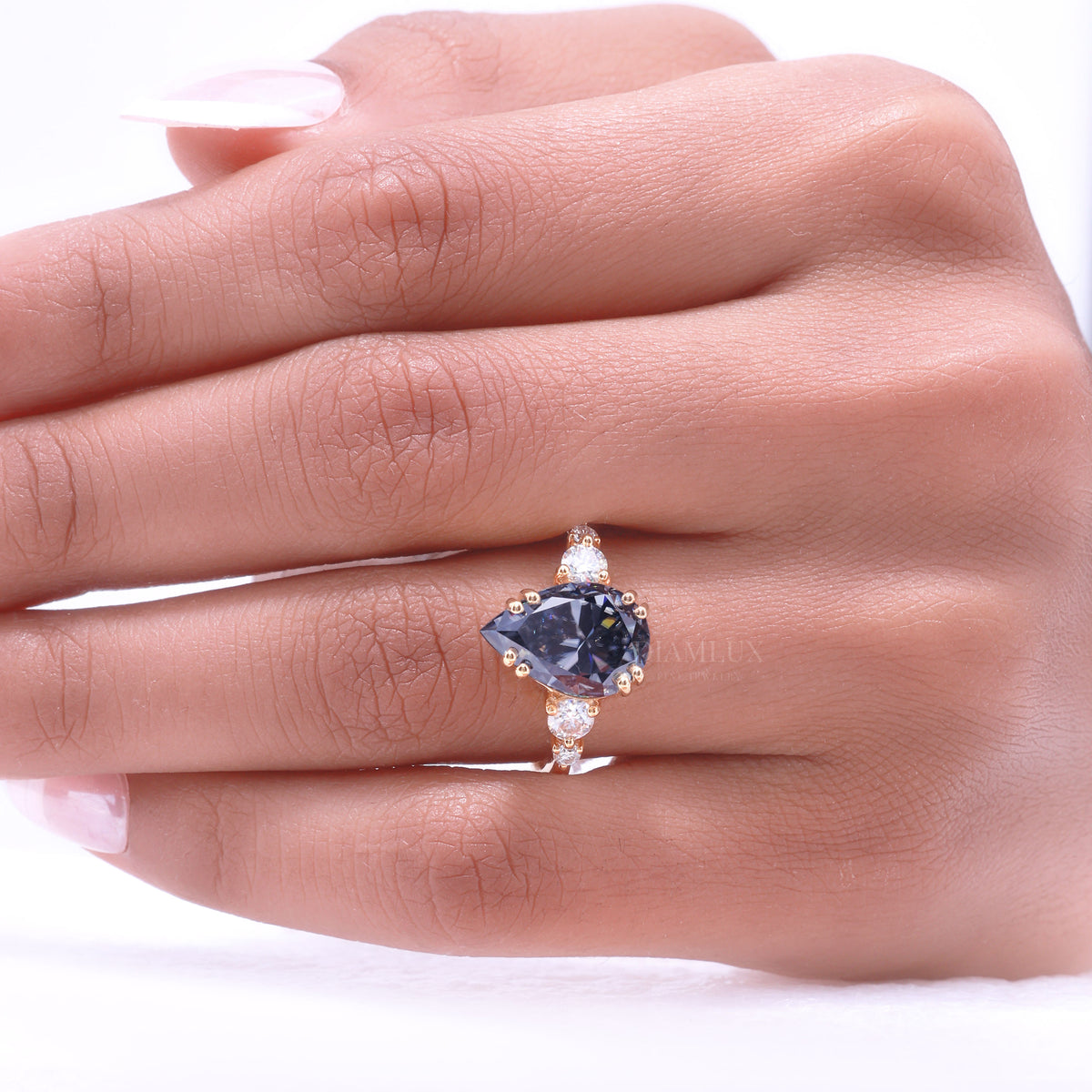 Yellow Gold Pear Shaped Dark Blue Gemstone Ring with Round Accent Stones Diamlux Fine Jewelry